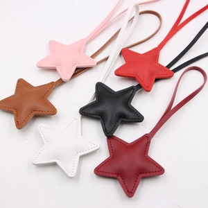 Star-shaped PU leather charms with fine stitching in multiple colors for bags and accessories