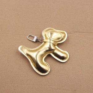 Pendentif chien en cuir PU doré avec fermoir argenté pour sacs et porte-clés