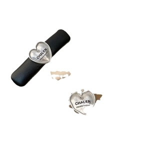 Elegant black PU leather hair clip featuring a silver metallic heart-shaped accent piece