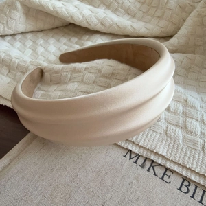 Elegant beige satin padded headband with a double-layered structure and silky finish