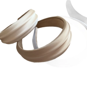 Chic padded satin headbands in cream and tan colors with elegant wide-brim design