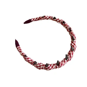 Padded red and white plaid headband with inner non-slip teeth for voluminous hair
