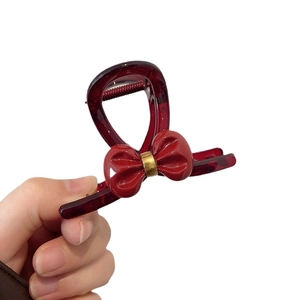 Elegant wine red bow hair claw clip with gold detail for women stylish hair accessory