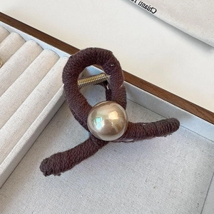 Brown knit rope hair claw clip with large champagne pearl accent for elegant hairstyles