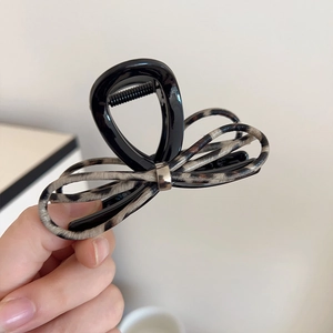 Brown leopard print ribbon bow claw clip for women made of premium resin with metal accent