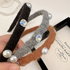 Knitted headband with pearls and zircon crystals in black, grey, and caramel colors