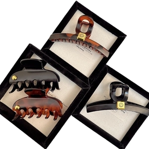 Elegant French chic large hair clips in black and tortoiseshell with gold smile charms