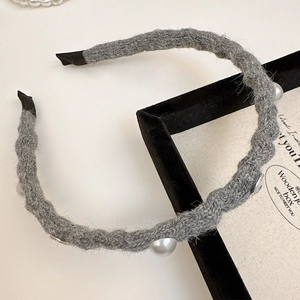 Knitted grey headband with pearls and rhinestones for an elegant autumn look