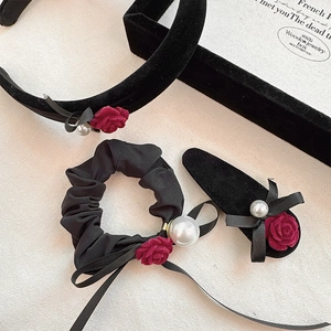 Detailed set of velvet hair accessories with deep red roses and elegant white pearls