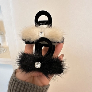 Plush faux fur claw clip set in black and beige with sparkling square crystal embellishment