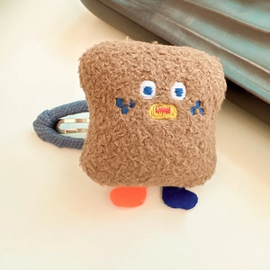 Cute brown plush toast hair clip with embroidered face and colorful feet detail