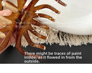 Detail shot of amber tortoiseshell claw clip with secure metal spring and durable teeth