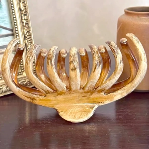 Detail of vintage wood-texture hair claw clip with golden brushstrokes on a retro background
