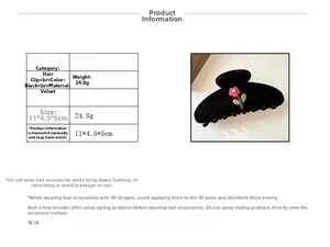 Detail view of black velvet flower hair claw clip with size dimensions and weight specifications