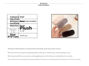 Detailed view of plush hair clips in cream, grey, camel and black showing soft texture