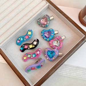 Colorful Y2K heart and wave hair clips set with sparkling rhinestones in a tray