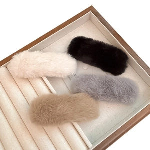 Faux fur hair clips in ivory, black, grey, and brown for elegant autumn styling