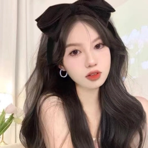 Elegant oversized black fabric bow headband with silver rhinestone circular earrings
