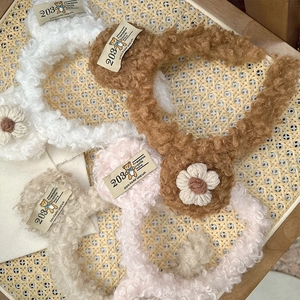 Plush bear-style headbands in neutral colors with knitted flowers and vintage fabric tags