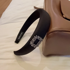 Elegant black wide headband with rhinestone square buckle and handmade label detail