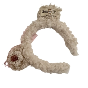 Plush teddy fleece bear headband with knitted flower and bow for women in off-white