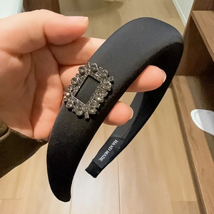 Elegant black padded headband with sparkling square crystal buckle and handmade satin finish