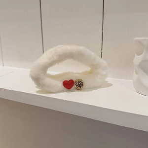Elegant white plush hair claw clip featuring red heart and gold camellia floral accents