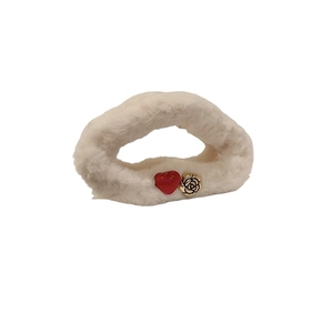 Plush beige faux fur hair claw clip featuring red heart and gold camellia floral accents