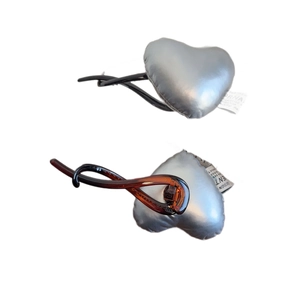 Silver metallic heart hair clips set with twisted amber resin and fabric label detail