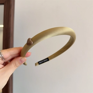 Elegant champagne satin headband with heart detail and hand-made tag for women