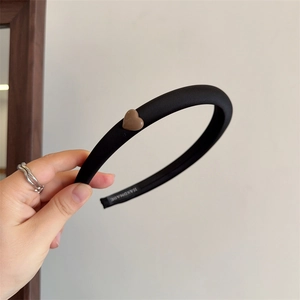Handmade black padded sponge headband with a brown resin heart accent for women