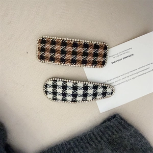 Elegant set of two houndstooth rhinestone hair clips with classic geometric patterns