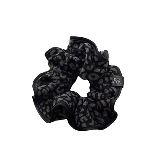 Large leopard print hair scrunchie with grey animal pattern and elastic hair tie