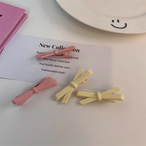 Set di fermagli per capelli a fiocco opaco in rosa pastello e giallo per donne