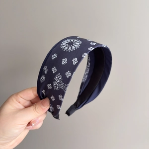 Ethnic bohemian style wide headband featuring dark blue paisley floral print fabric