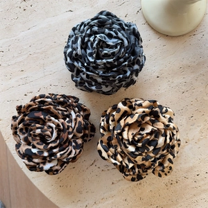 Three elegant leopard print rose flower hair claws in grey, brown, and gold chiffon