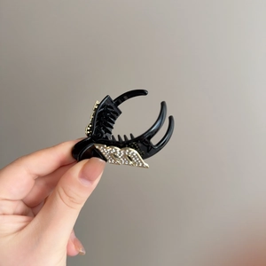 Elegant black hair claw clip with sparkling rhinestone letter M design for women