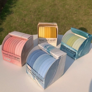 Detail of multi-color high elasticity hair tie sets in marble pattern gift boxes