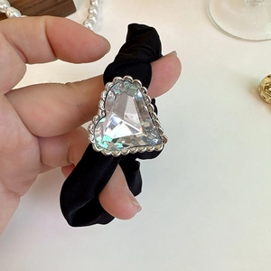 Elegant black satin hair scrunchie with large sparkling heart-shaped crystal detail