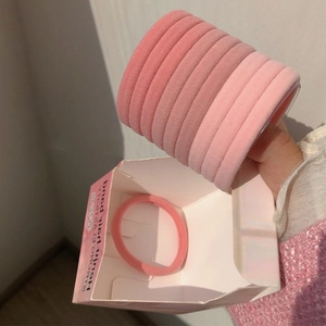 Detail of pink gradient hair ties set featuring soft towel texture and high elasticity