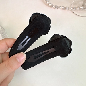Pair of retro French black fabric camellia flower hair clips with metal duckbill base