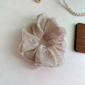 Elegant off-white mesh scrunchie with silver embroidery and beads for hair styling