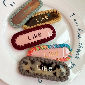 Barrettes à cheveux en acétate coloré avec lettres Like et bordure en coton tressé