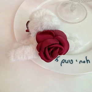 Elegant plush flower hair claw with white faux fur and a large dark red satin rose