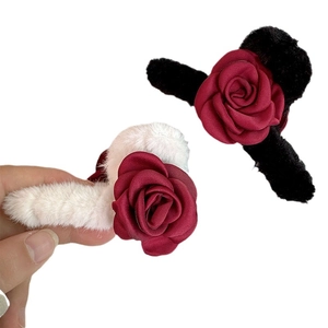 Elegant large plush flower hair claw clips with velvet roses in classic black and white