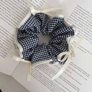 Classic black and white checkered scrunchie with cute satin bows in a vintage French style