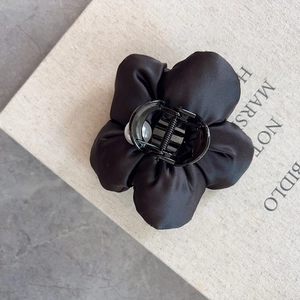 Elegant black satin flower hair claw clip with a pearl center for women's hair styling