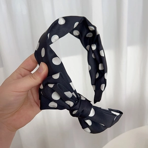 Retro black polka dot headband with large bow tie, vintage elegant fashion hair accessory