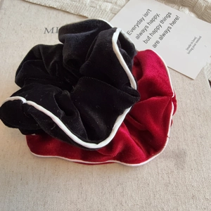Elegant velvet hair scrunchies set in black and burgundy with white piping detail