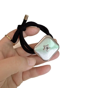 Silver brushed square hair tie with star rhinestone inlay on black elastic rope